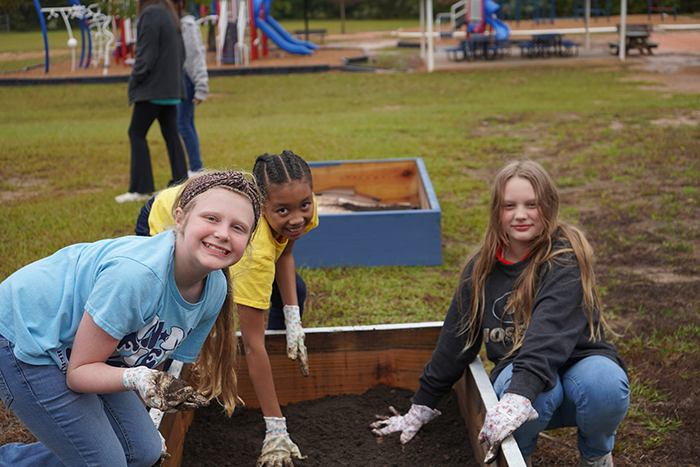 Filling the Raised Beds at Heritable Elementary | Shaome Cooperative